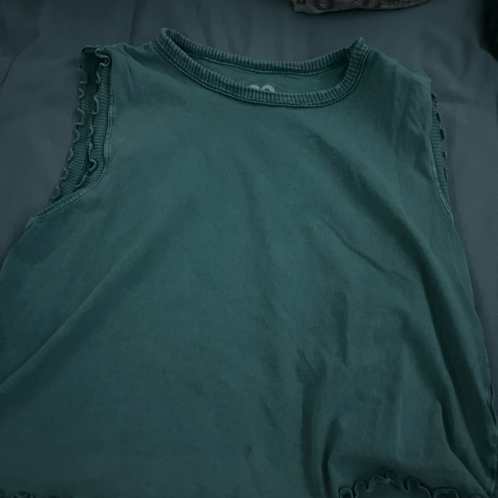 grey blue tank top with ruffles around it